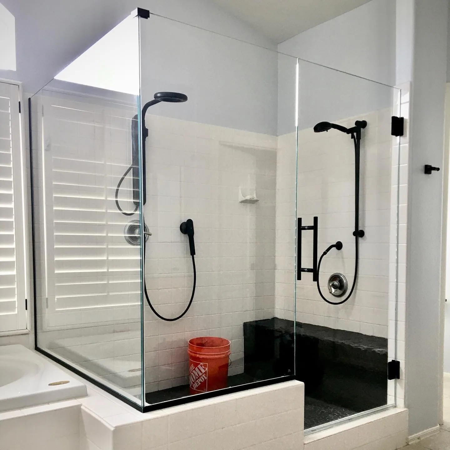 Completed steam shower enclosure with sealed glass and operable transom in a Las Vegas home