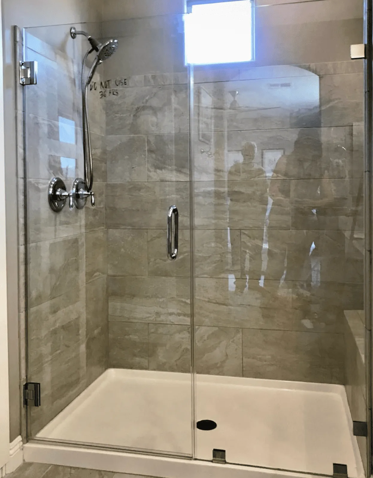 Custom corner shower enclosure with clear glass panels