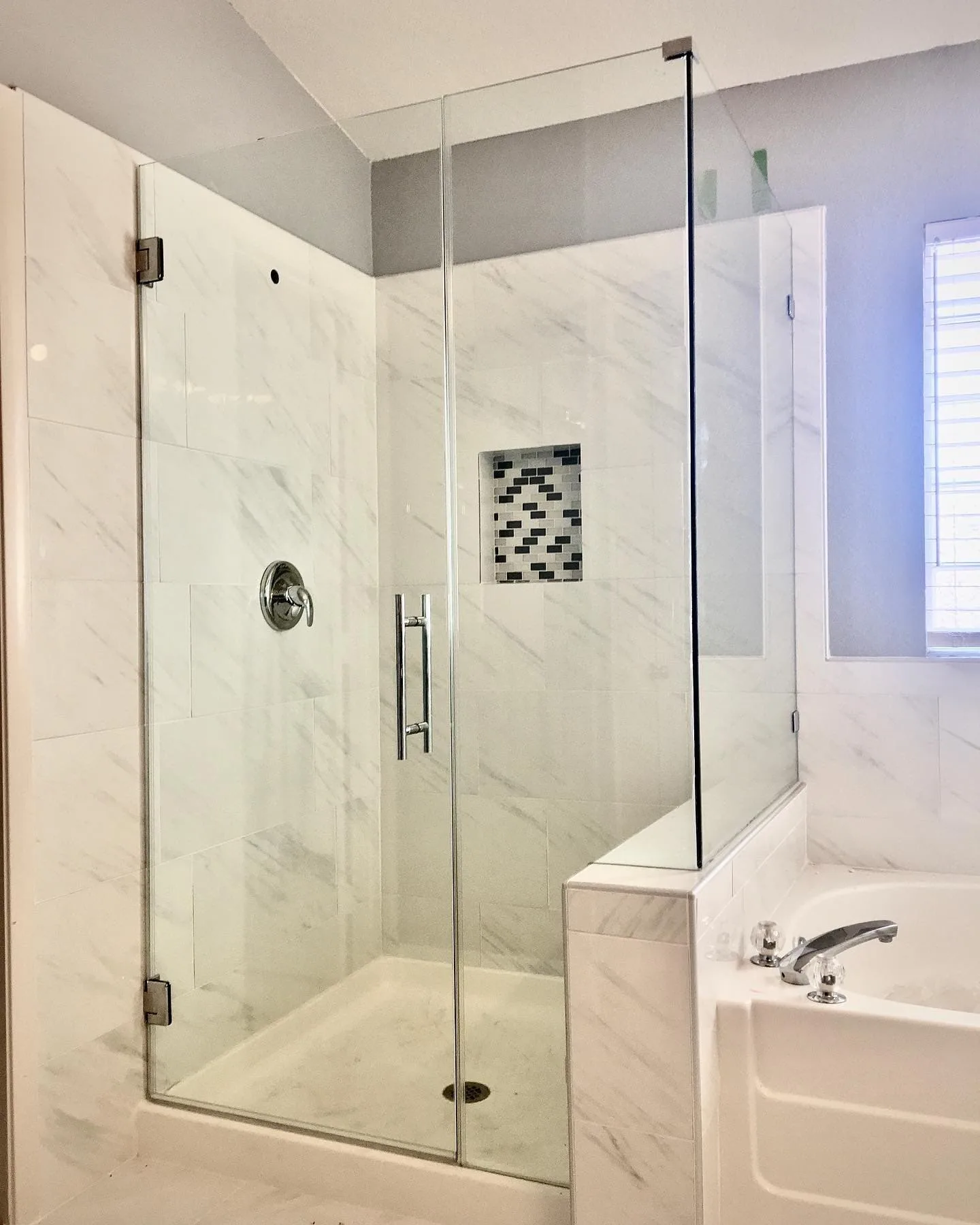 Custom frameless shower door installed in a Centennial Hills Las Vegas bathroom