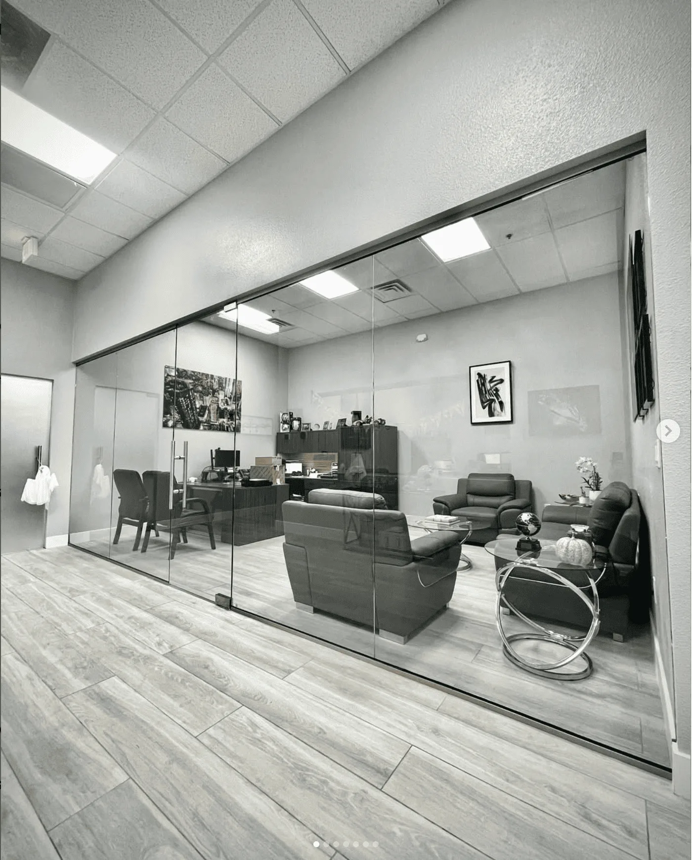 Modern office with glass conference room partitions and professional interior design