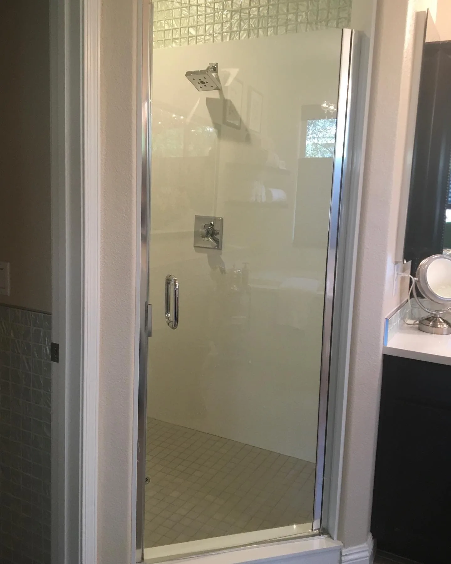 Single panel shower door with chrome hardware