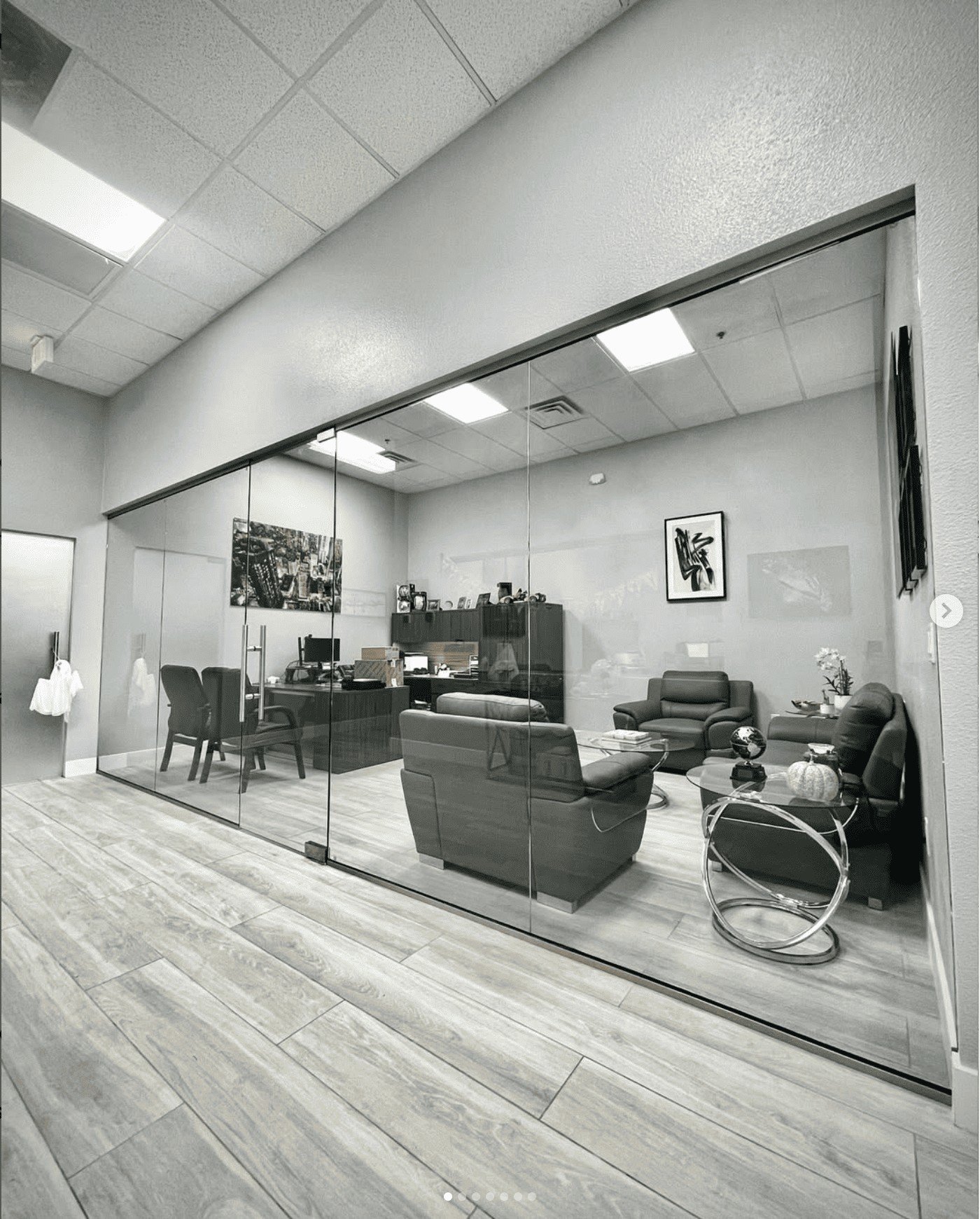 Modern office with glass conference room partitions and professional interior design